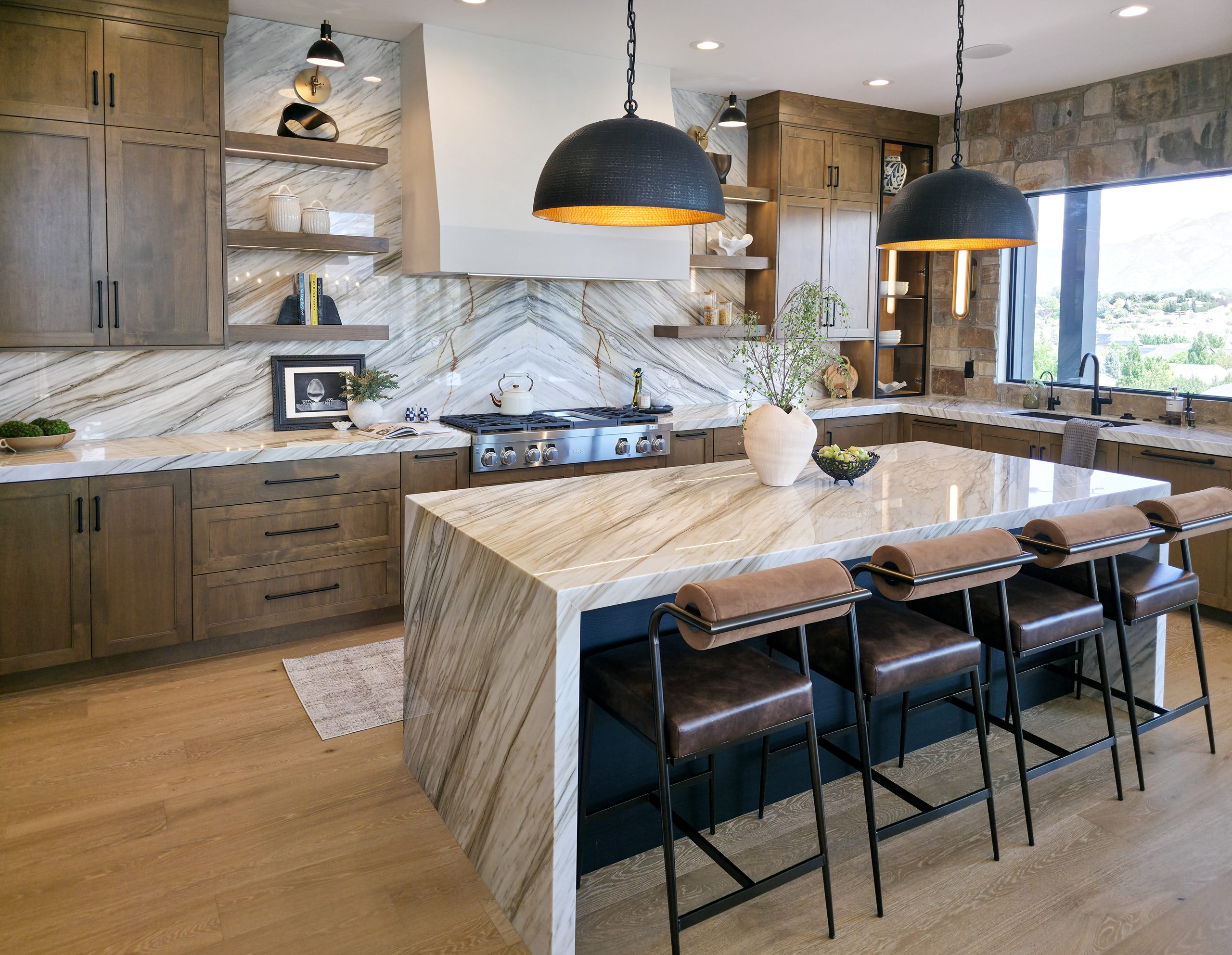 Kitchen countertops and hardwood flooring paired in a warm kitchen